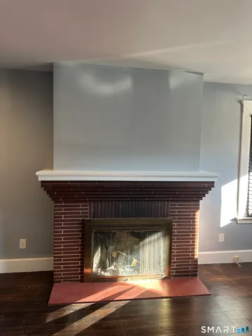 a view of fireplace in wooden floor