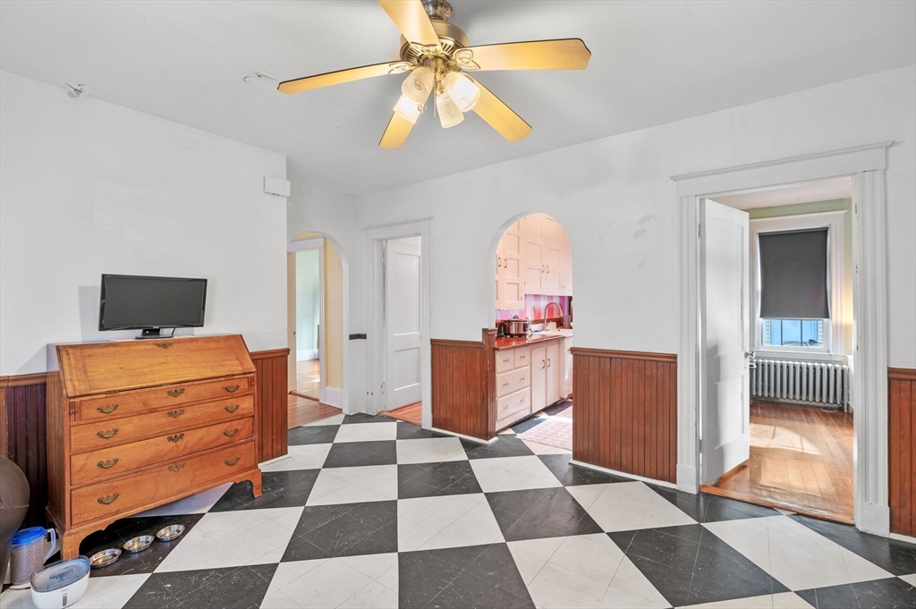 9 Glover Street, Unit 1 Salem, MA 01970 - Photo 14 of 34 a room with furniture and a flat screen tv