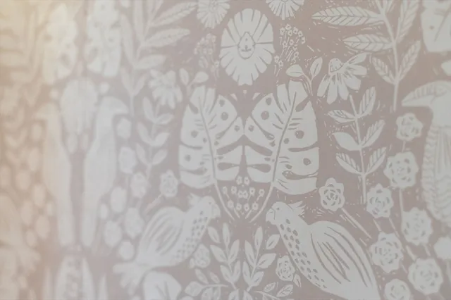 a view of a room with furniture and windows