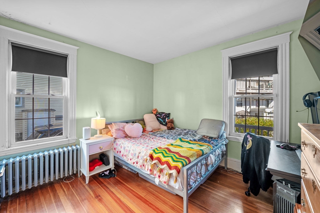 9 Glover Street, Unit 1 Salem, MA 01970 - Photo 25 of 34 a bedroom with a bed and a window