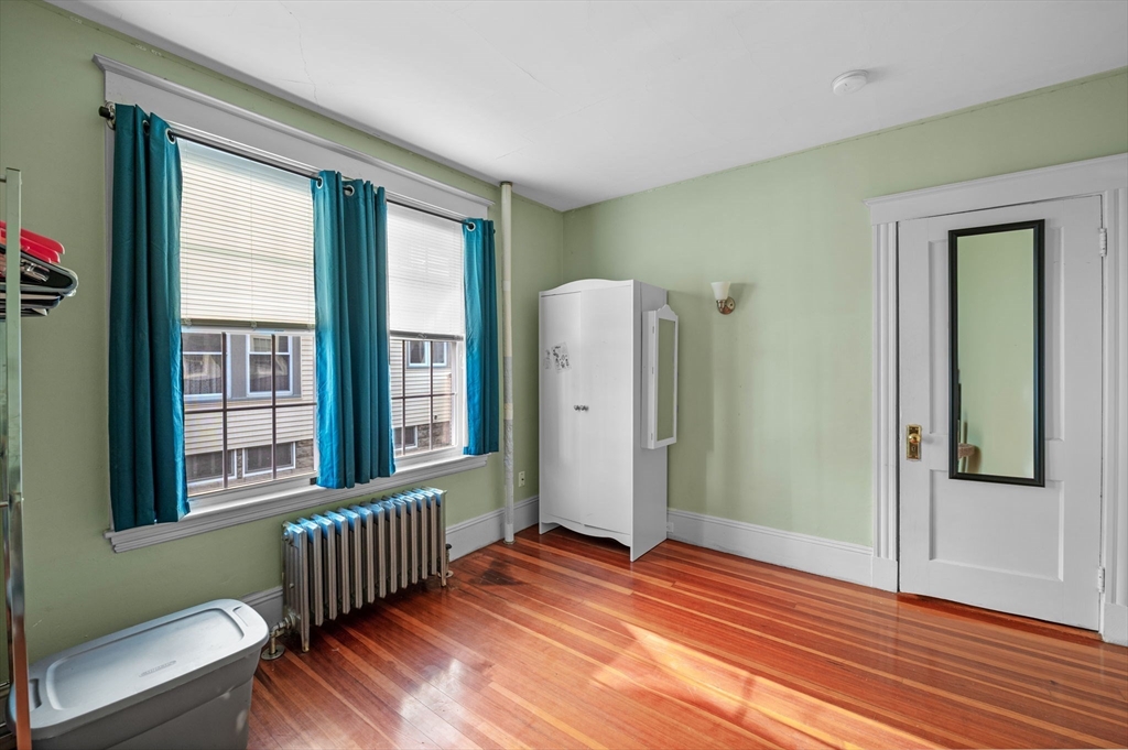 9 Glover Street, Unit 1 Salem, MA 01970 - Photo 28 of 34 a view of a room with wooden floor and windows