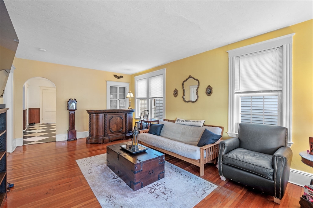 9 Glover Street, Unit 1 Salem, MA 01970 - Photo 4 of 34 a living room with furniture and wooden floor