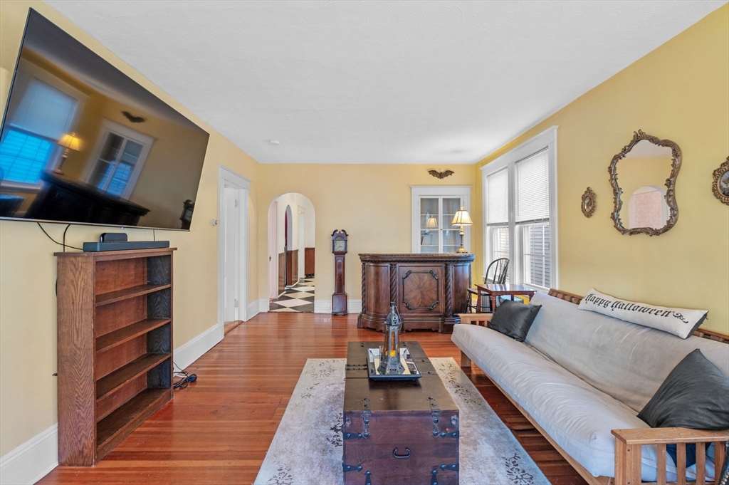 9 Glover Street, Unit 1 Salem, MA 01970 - Photo 5 of 34 a living room with furniture and a flat screen tv