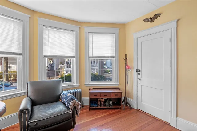 a living room with furniture and windows