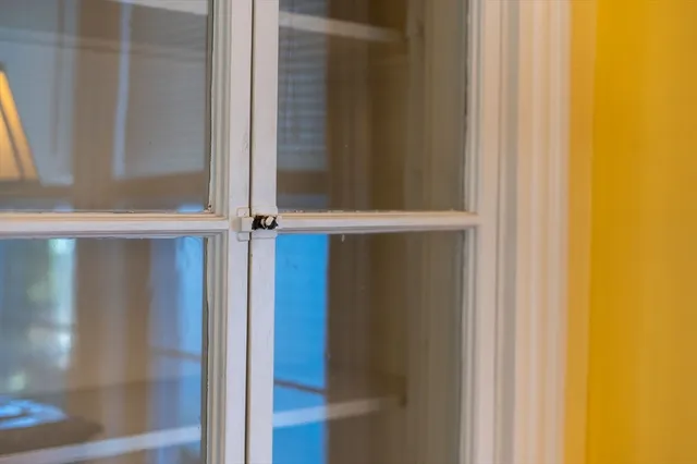 a black and white checkered floor with a black white checkered floor next to a window