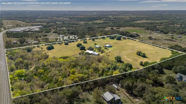 an aerial view of house with yard