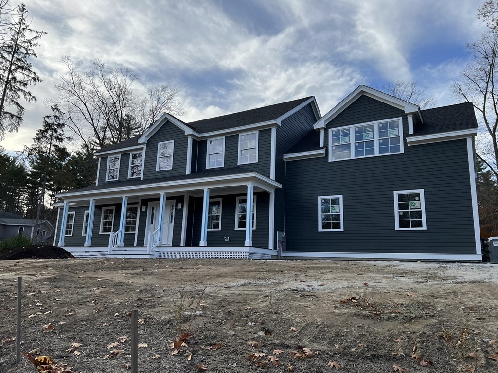 25 Mill Road Harvard, MA 01451 - Photo 1 of 1 a front view of a house with a garden