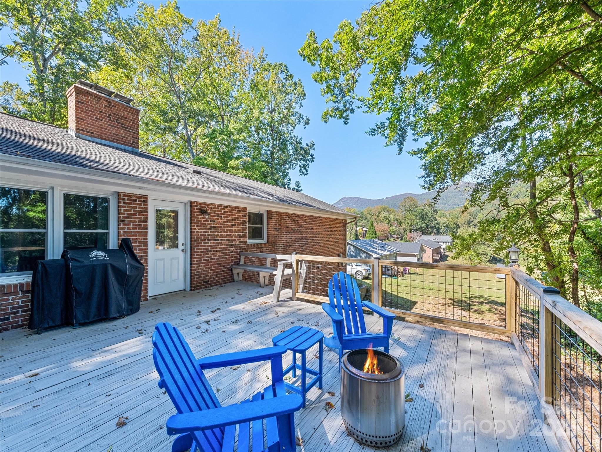 263 Blanton Street Columbus, NC 28722 - Photo 9 of 45 a view of house with patio outdoor seating
