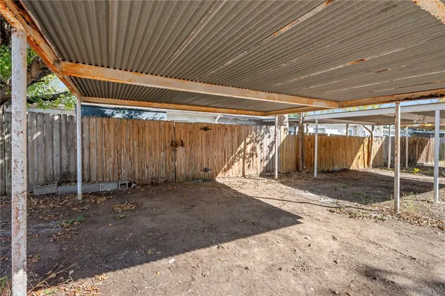 a view of a room with wooden walls