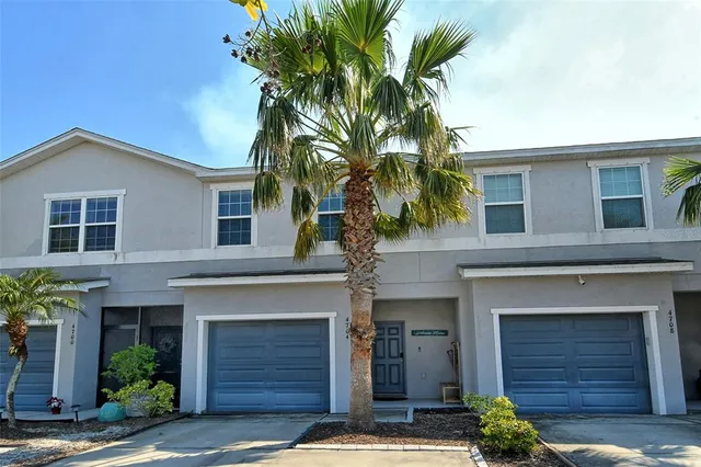 a front view of a house with a garage
