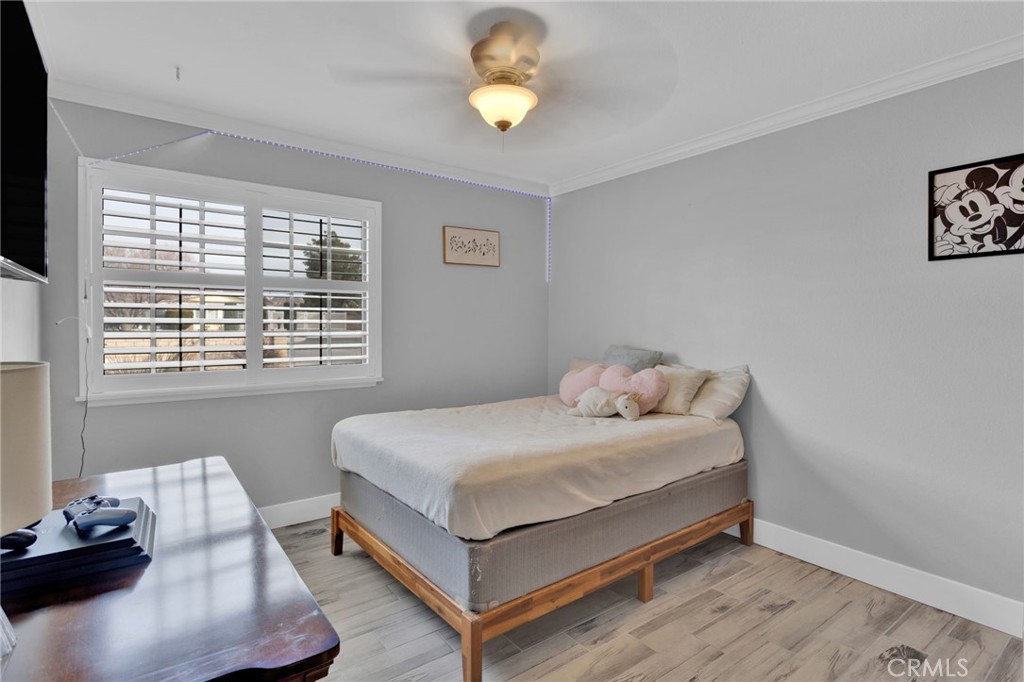 19655 Seneca Road Apple Valley, CA 92307 - Photo 12 of 67 a bedroom with a bed and a window