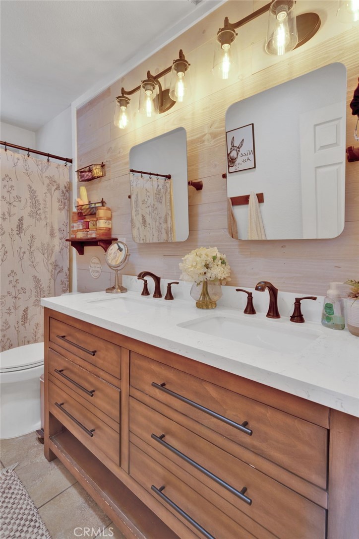 19655 Seneca Road Apple Valley, CA 92307 - Photo 15 of 67 a bathroom with a sink and a mirror