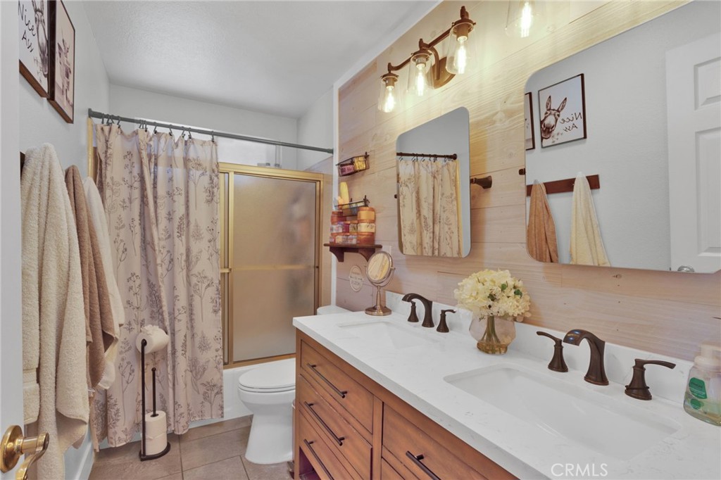 19655 Seneca Road Apple Valley, CA 92307 - Photo 16 of 67 a bathroom with a sink and a mirror