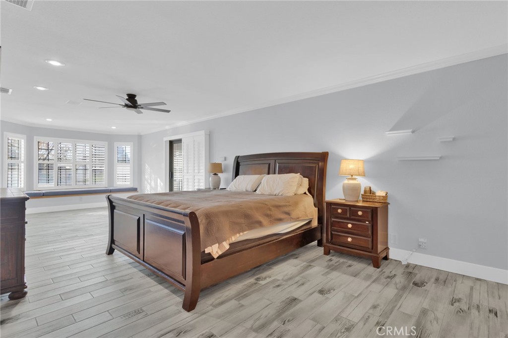 19655 Seneca Road Apple Valley, CA 92307 - Photo 18 of 67 a bedroom with a bed and window