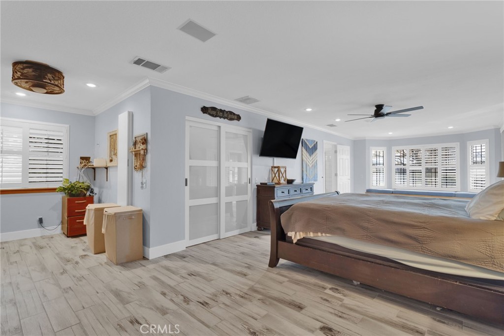 19655 Seneca Road Apple Valley, CA 92307 - Photo 20 of 67 a spacious bedroom with a bed and a television