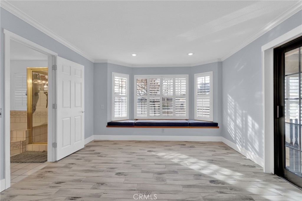 19655 Seneca Road Apple Valley, CA 92307 - Photo 21 of 67 a view of an empty room with glass door and windows