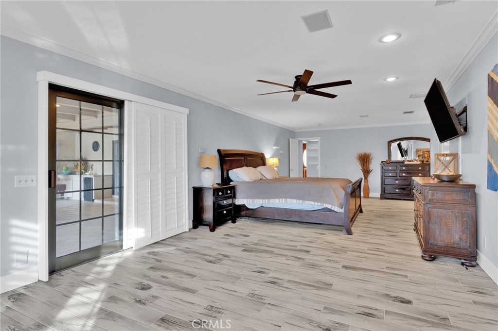 19655 Seneca Road Apple Valley, CA 92307 - Photo 24 of 67 a bedroom with furniture and a large mirror