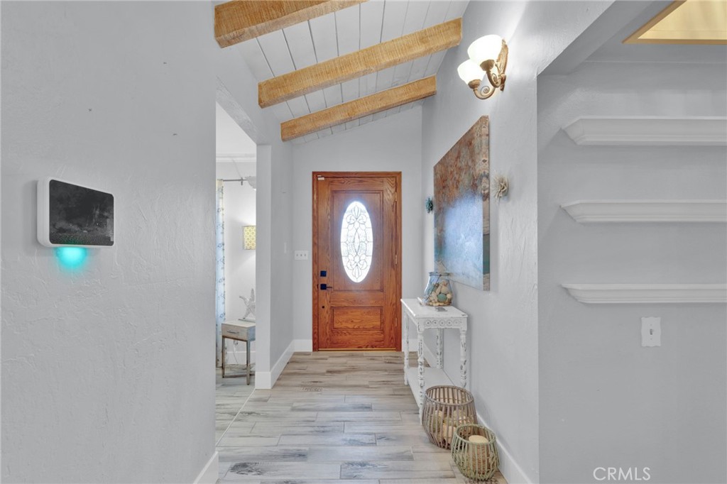19655 Seneca Road Apple Valley, CA 92307 - Photo 27 of 67 a view of a hallway with wooden floor and entryway
