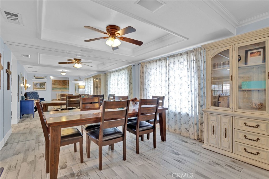 19655 Seneca Road Apple Valley, CA 92307 - Photo 30 of 67 a view of a dining room with furniture window and wooden floor
