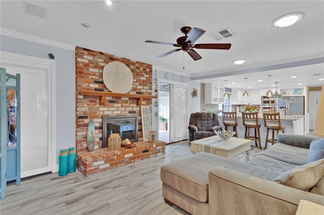 19655 Seneca Road Apple Valley, CA 92307 - Photo 35 of 67 a living room with furniture a fireplace and a chandelier