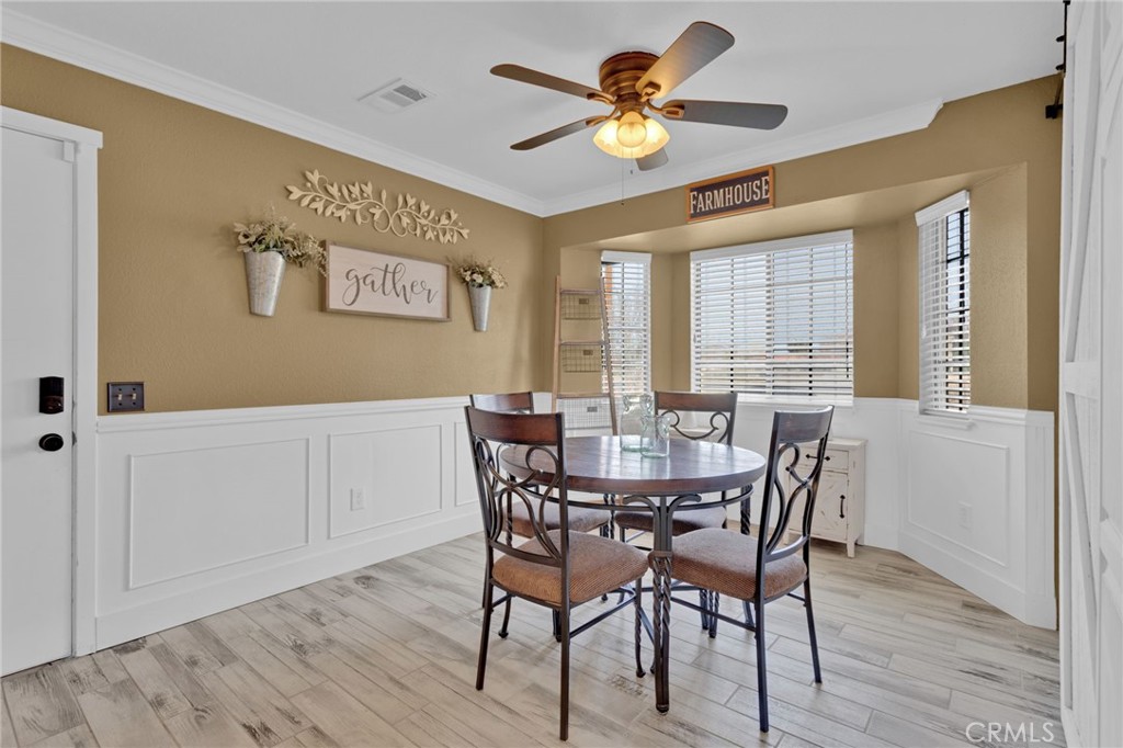 19655 Seneca Road Apple Valley, CA 92307 - Photo 42 of 67 a view of a dining room with furniture and a window