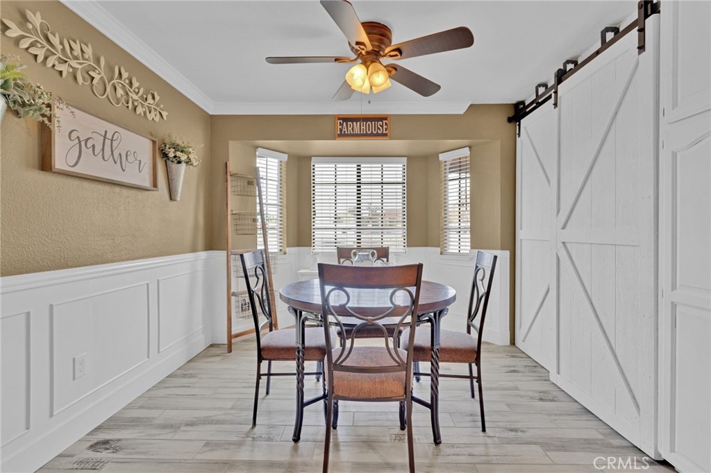 19655 Seneca Road Apple Valley, CA 92307 - Photo 43 of 67 a view of a dining room with furniture window and wooden floor