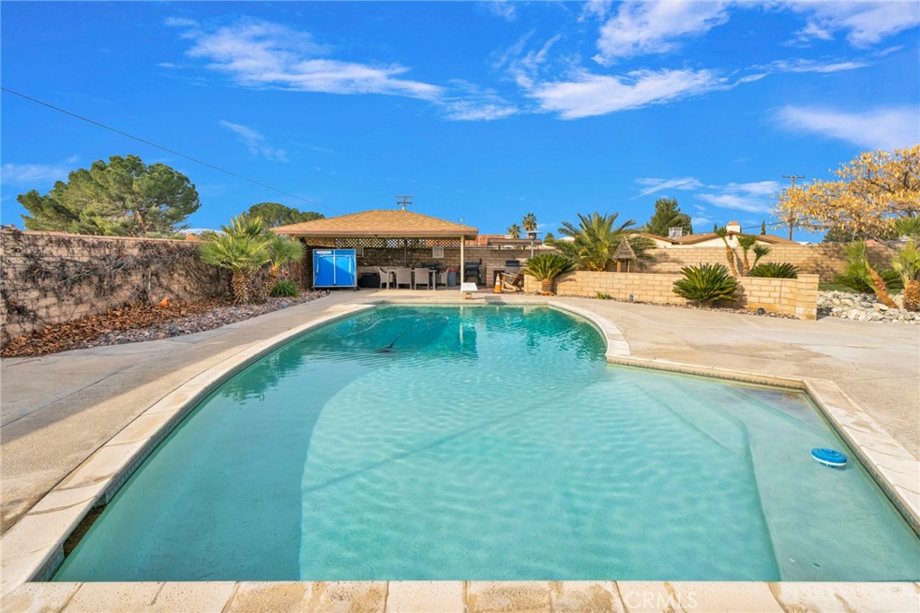 19655 Seneca Road Apple Valley, CA 92307 - Photo 50 of 67 a view of a house with a yard
