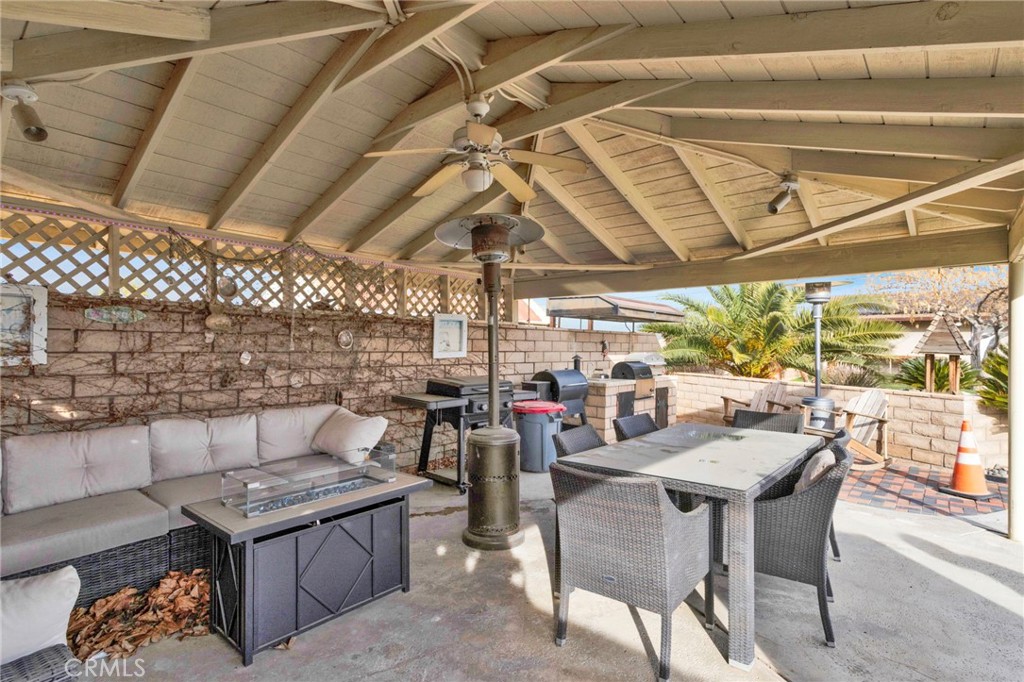 19655 Seneca Road Apple Valley, CA 92307 - Photo 54 of 67 a view of a patio with a table and chairs
