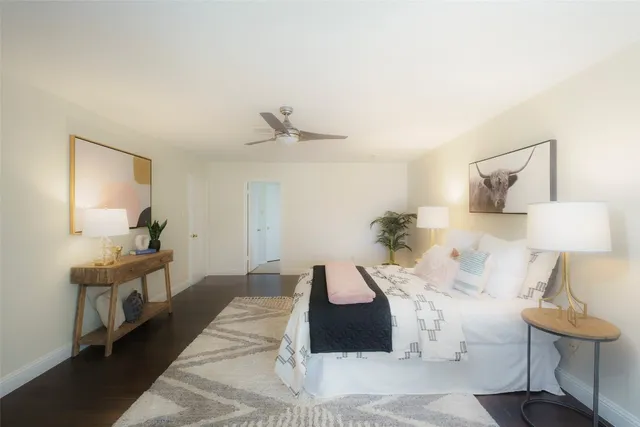 a bedroom with a bed and a lamp