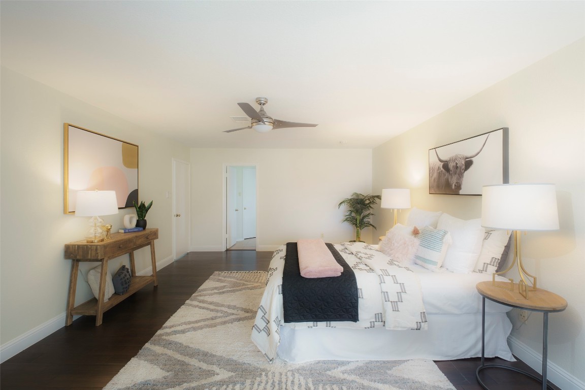 2201 Broughton Court Austin, TX 78727 - Photo 15 of 31 a bedroom with a bed and a lamp