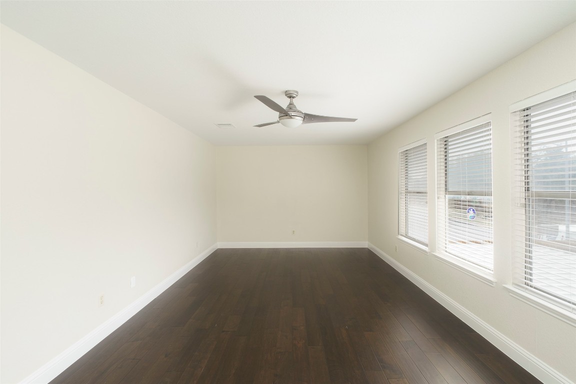 2201 Broughton Court Austin, TX 78727 - Photo 22 of 31 an empty room with a window and a ceiling fan