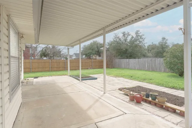 a view of a backyard with grass