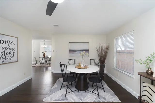 a view of a dining room with furniture and wooden floor