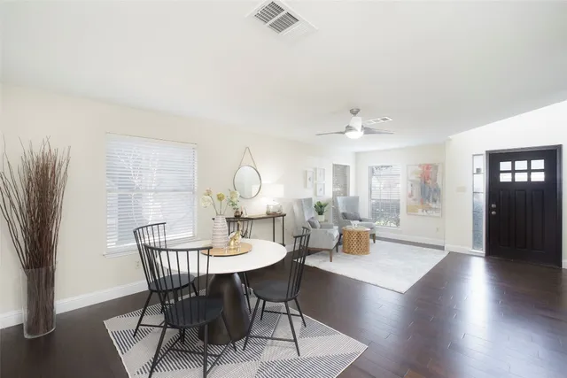 a view of a dining room with furniture window and wooden floor