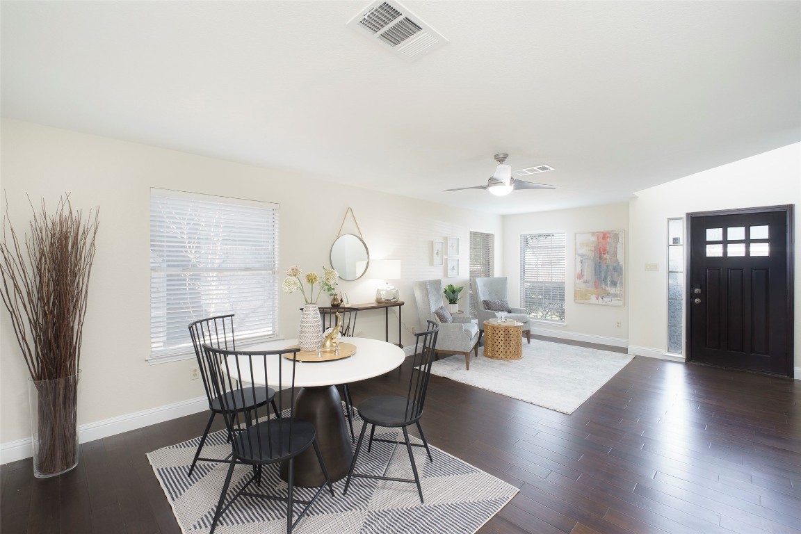 2201 Broughton Court Austin, TX 78727 - Photo 7 of 31 a view of a dining room with furniture window and wooden floor