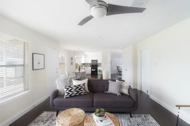 a living room with furniture and a window