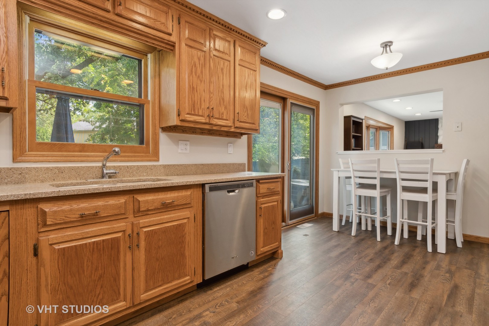 2106 Templar Drive Naperville, IL 60565 - Photo 6 of 17 a kitchen with table chairs sink and cabinets