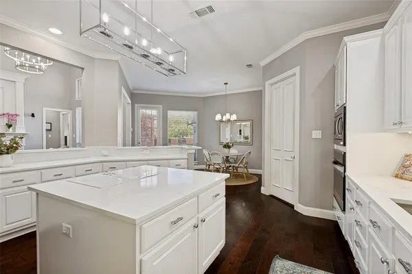 a spacious bathroom with a sink a large mirror and a shower