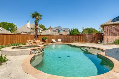 a view of a swimming pool from a balcony