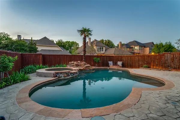 a view of a swimming pool with an outdoor seating
