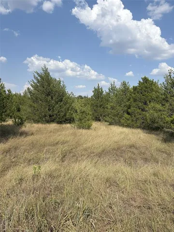 a view of an ocean and a building in the background