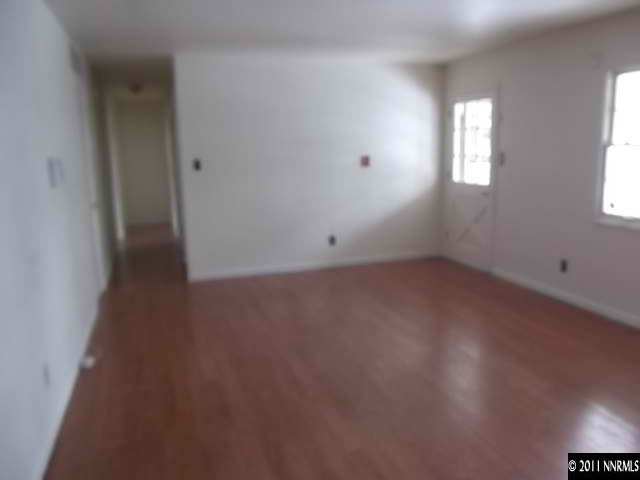 1401 Elizabeth Street Reno, NV 89509 - Photo 12 of 12 an empty room with wooden floor and windows