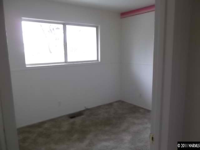 1401 Elizabeth Street Reno, NV 89509 - Photo 7 of 12 an empty room with a window