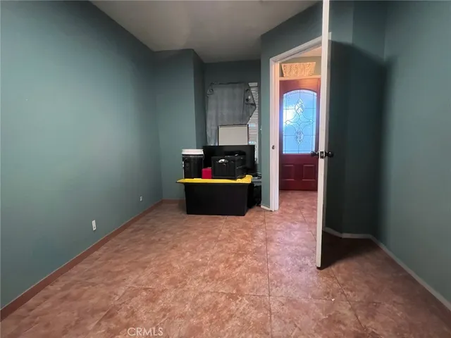 a view of living room with furniture and a potted plant