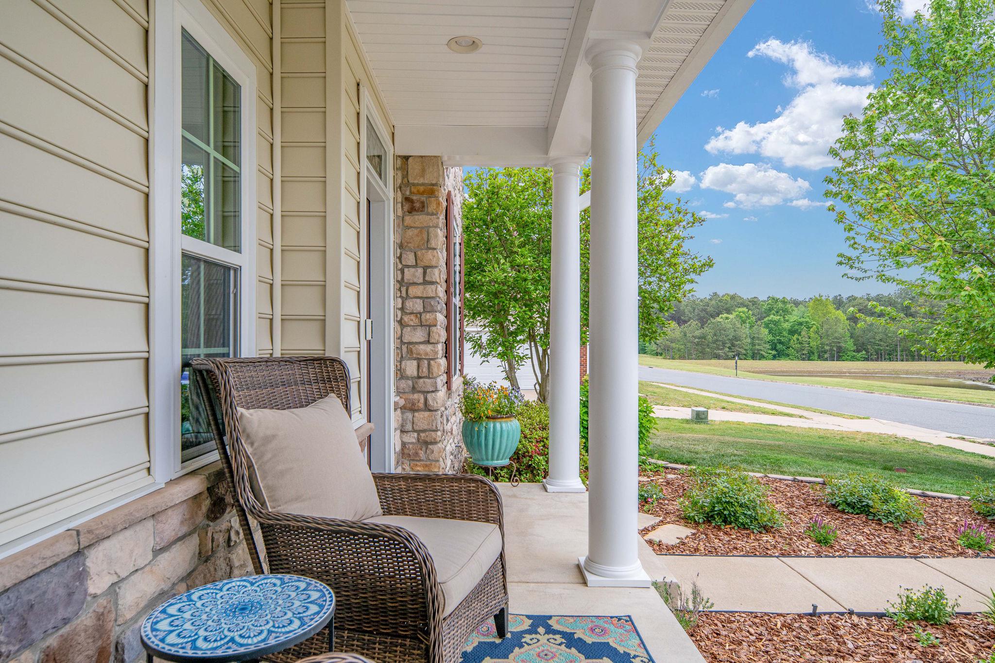 9417 Reservoir Road Fredericksburg, VA 22407 - Photo 6 of 76 a view of a porch with furniture and a yard