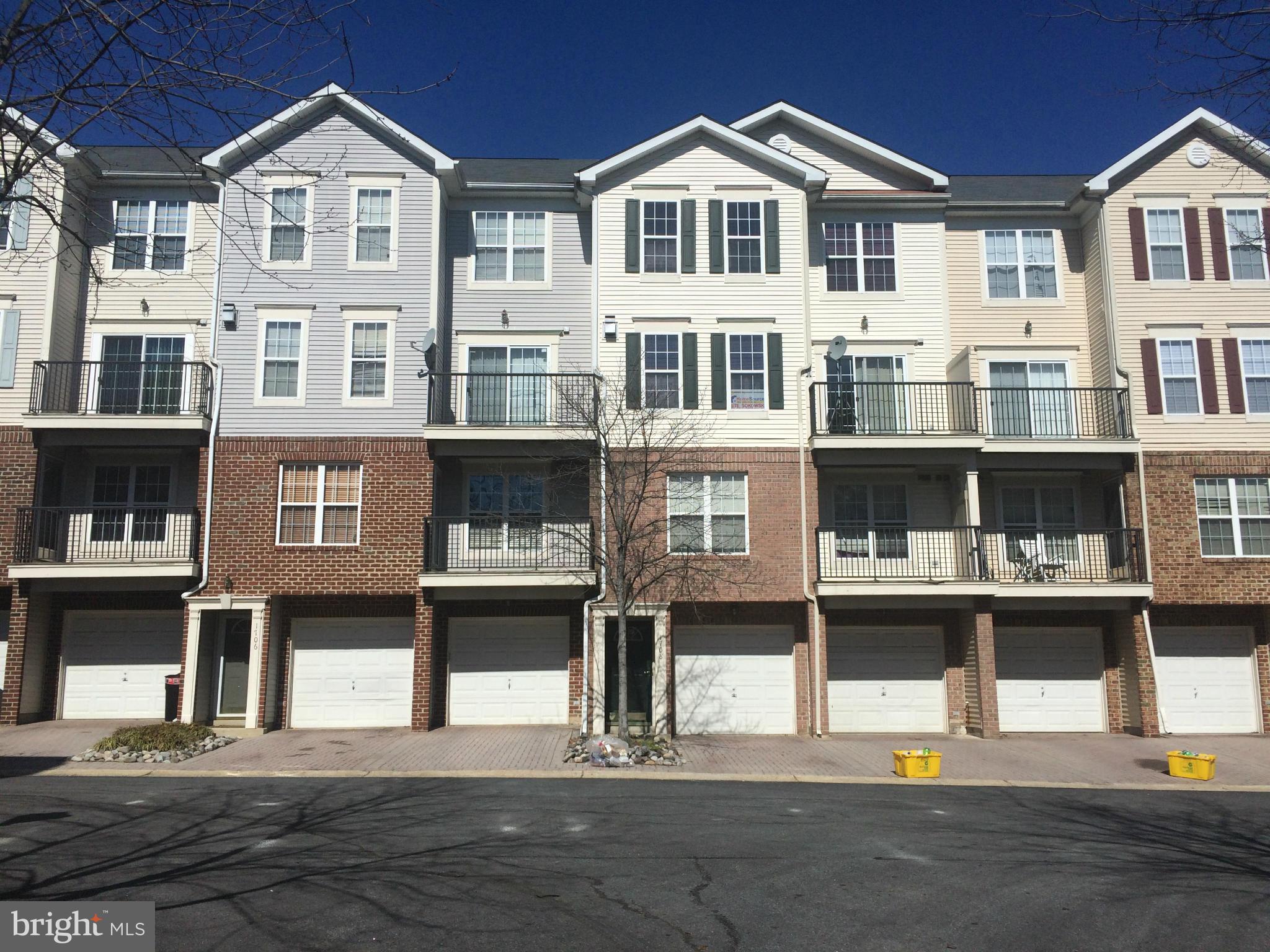1708 Silver Bell Circle, Unit 129 Bowie, MD 20721 - Photo 1 of 1 a front view of a large white building