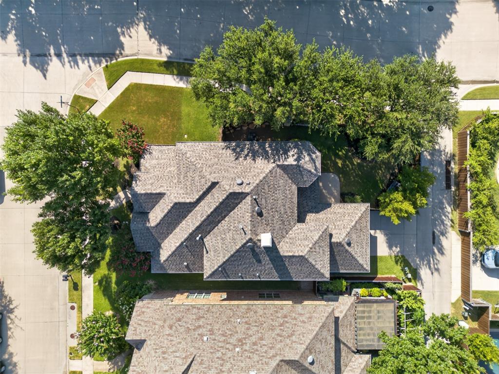 842 Sun Meadow Road Allen, TX 75013 - Photo 5 of 39 Gabled roofline property featuring a corner lot with manicured lawn and mature trees