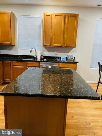 a view of a kitchen counter top space and wooden floor