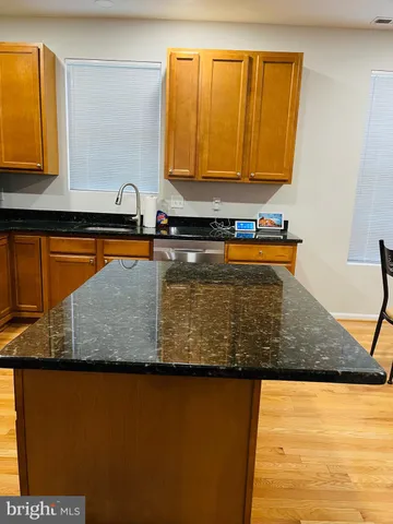 a view of a kitchen counter top space and wooden floor