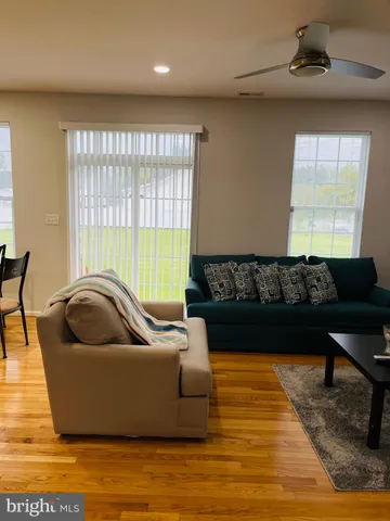 a living room with furniture and a rug